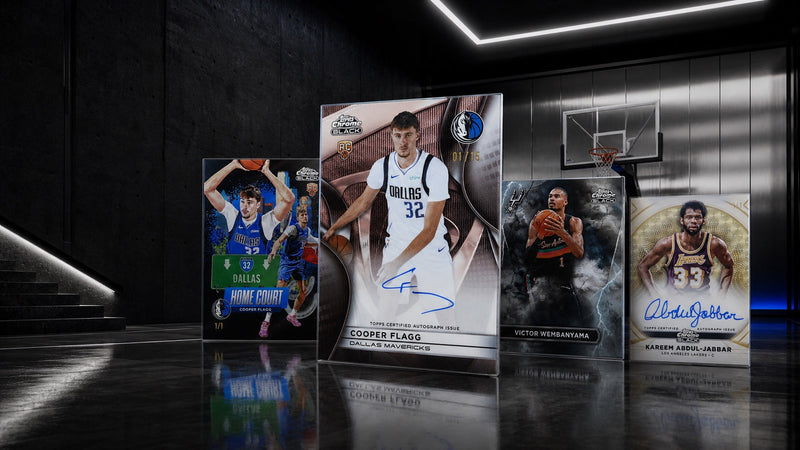 Cooper Flagg, Victor Wembanyama, Kareem Abdul-Jabbar, and Home Court cards on a black chrome basketball court